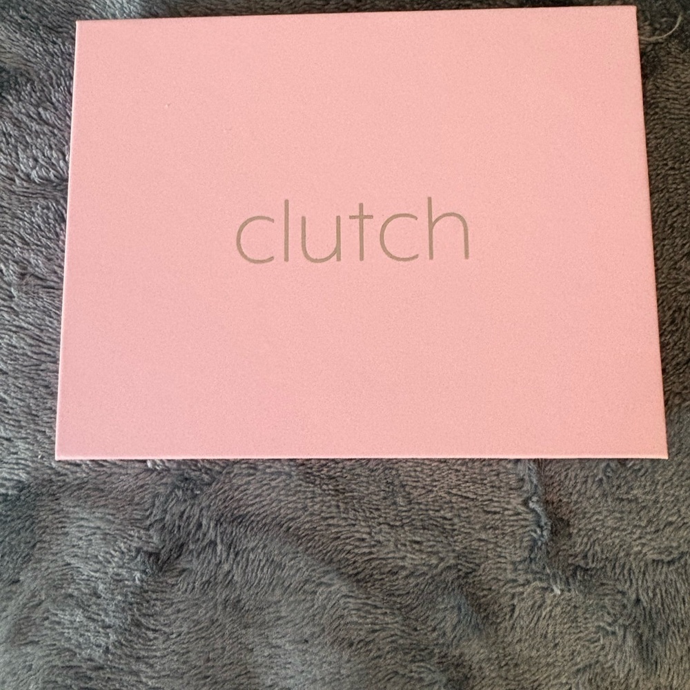 Pink Clutch charging brick for iPhone 14 or lower.